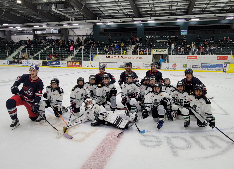 Portage U11 female hockey team shares the ice with former NHLers